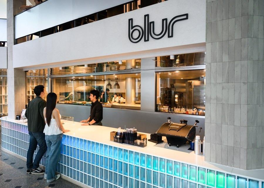 Hotel guests ordering at Blur Café